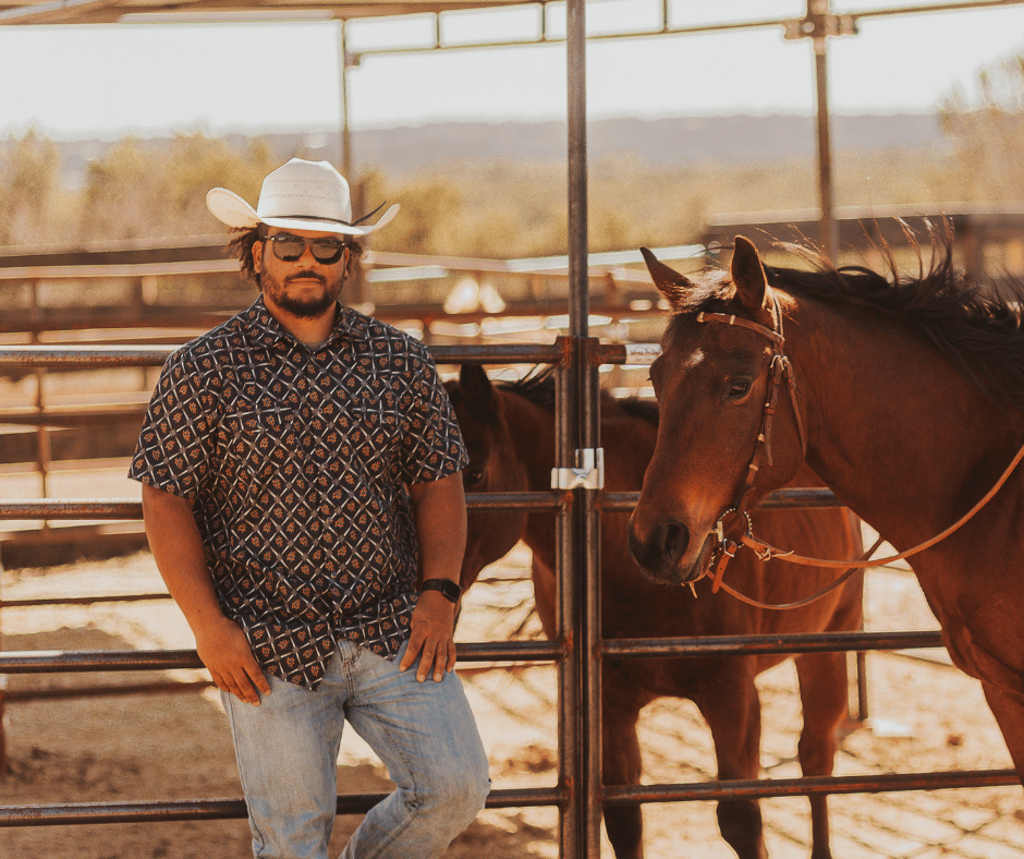 John Dawson with horses in arena