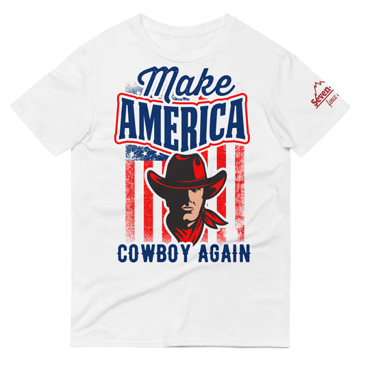 T-Shirt in different colors with a photo of a cowboy and the text saying Make America Cowboy Again with an American Flag in the background.
